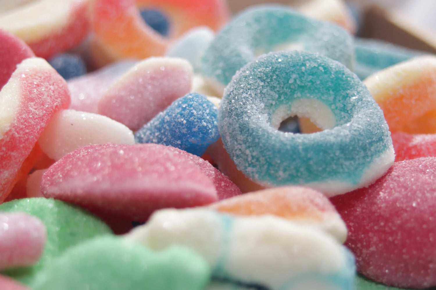 A vibrant selection of fizzy rings, gummy hearts, and retro candies for our custom pick and mix sweet delivery service in Swindon.