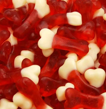 A spooky pile of pink and white Kingsway jelly bone sweets featuring a dual-layer texture with soft foam backings and glossy fruit jelly tops.