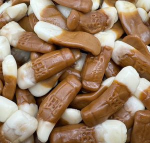 A delicious arrangement of Kingsway pint pot jelly sweets shaped like miniature dual-toned beer glasses with white foam tops and amber-coloured bases.