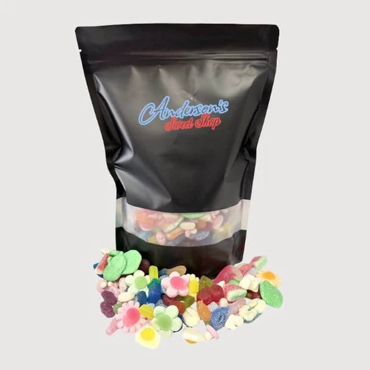 A premium, freshly packed black resealable custom pick and mix sweet pouch overflowing with retro jellies and chocolates.